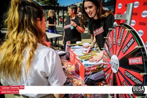 Deakin University Contract Cheating Campaign featuring photograph of campaign staff and a student. 